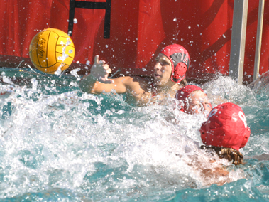 John Kaplanis, the goalie for the men's waterpolo team at San
Benito High School, defends the net as teammates Greg Valenzuela,
center, and Rory Block, right, stand by ready to help defend.