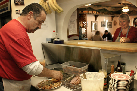 Phil Barrett prepared an omelet at Flapjacks Restaurant in Tres
Pinos while his wife Karen waited to serve the plate.