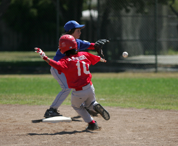Jose Rodriguez of Hollister American slid safely into second
base July 14 against Hollister National in a game played at
Continental Little League Field in Salinas.