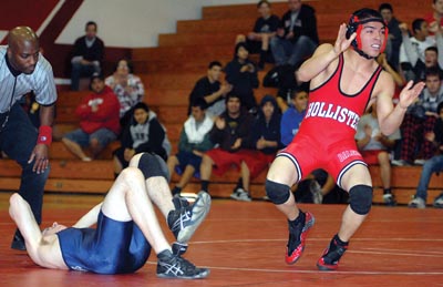 San Benito senior Junior Davila, above winning by pin over
Bellarmine's R.J. Raffanti, is currently ranked No. 1 in the
Central Coast Section at 119 pounds.