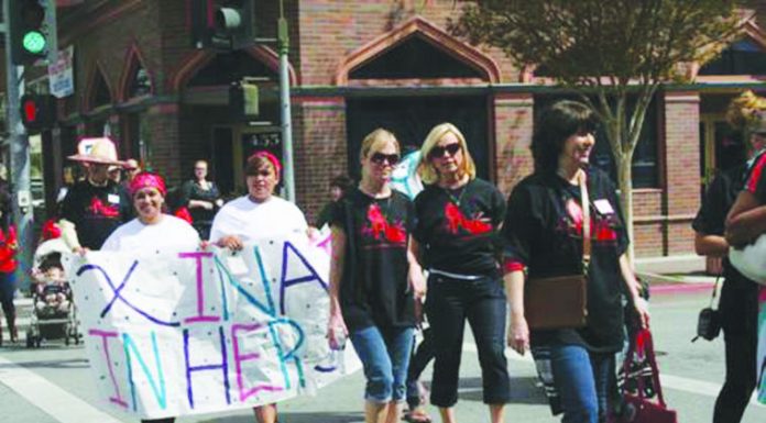 ‘Walk a Mile in Her Shoes’ event downtown draws 70 walkers
