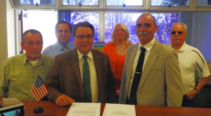 Photo: Officials commemorate long-awaited transfer of main street