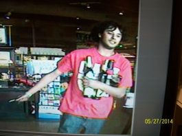 Man caught on camera leaving Safeway holding liquor bottles, knife