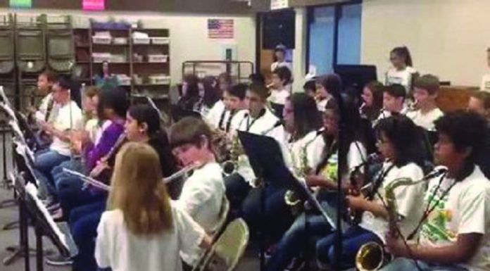 Travel band plays for local students