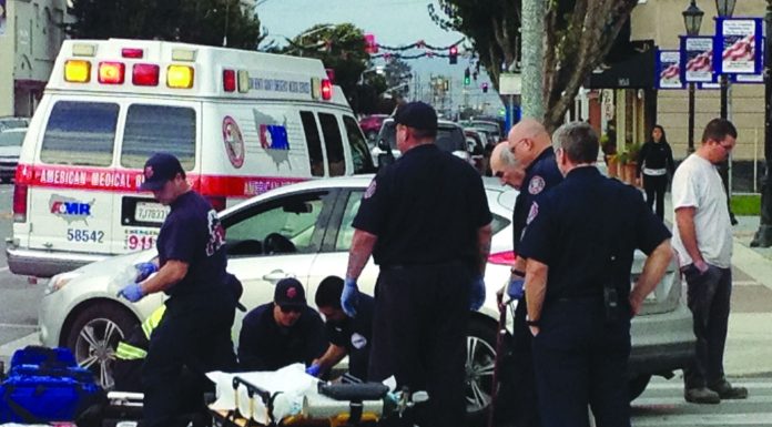 Car hits pedestrian in downtown crosswalk