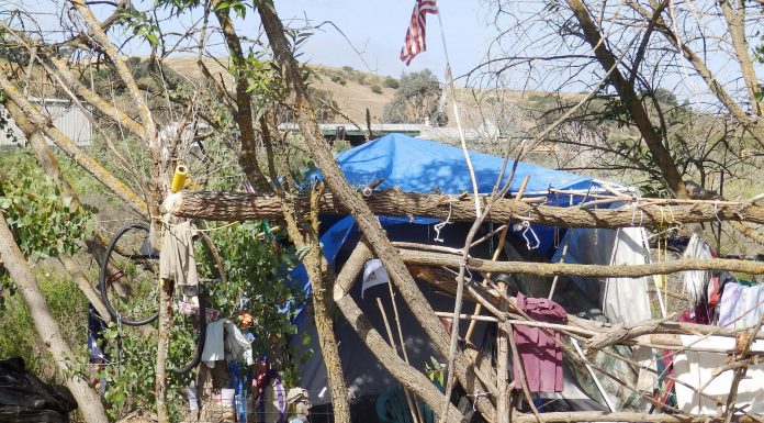 Homeless encampment grows along riverbed