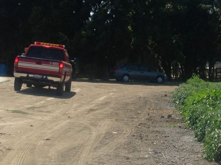 Fire sparks in dry riverbed near homeless encampment