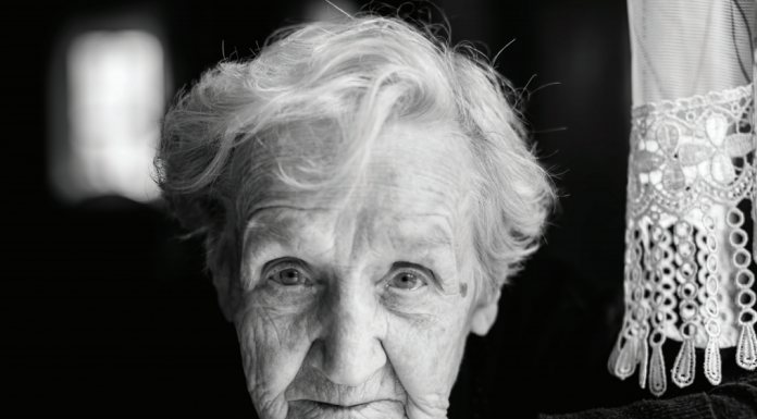 senior woman facing camera b/w photo