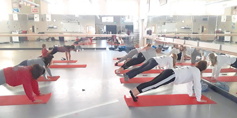 Students teach teachers yoga