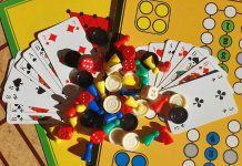 Various board games, game pieces, dices and playing cards